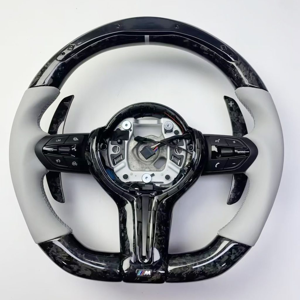 BMW steering wheel with silver gray Nappa leather, forged carbon, LED light strip and carbon paddles