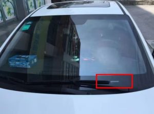 Vehicle VIN plate location at the lower edge of a windshield