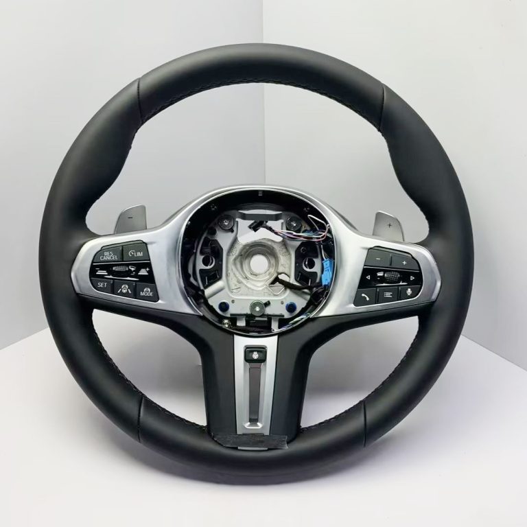 BMW heated steering wheel with real black leather, silver trim, multifunction buttons and paddles