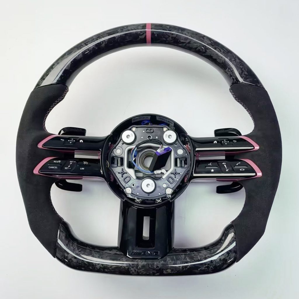 Mercedes-Benz steering wheel with forged carbon, pink button trim, pink center marker and black grips