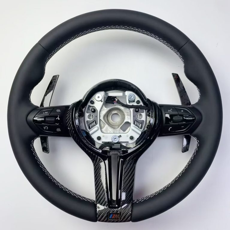 BMW steering wheel with real black leather, white stitching, gloss carbon trim and extended carbon paddles