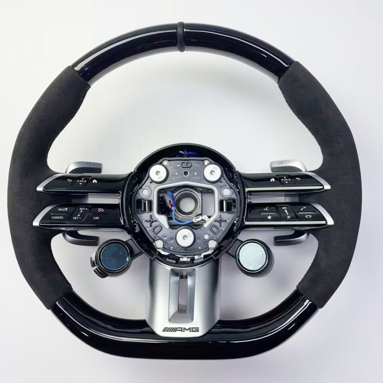 Mercedes-Benz wheel with black wood, black Alcantara, twin OLED controls and a leather center marker